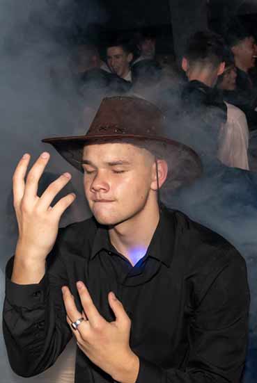 Student with hat at Birkenhead College Ball